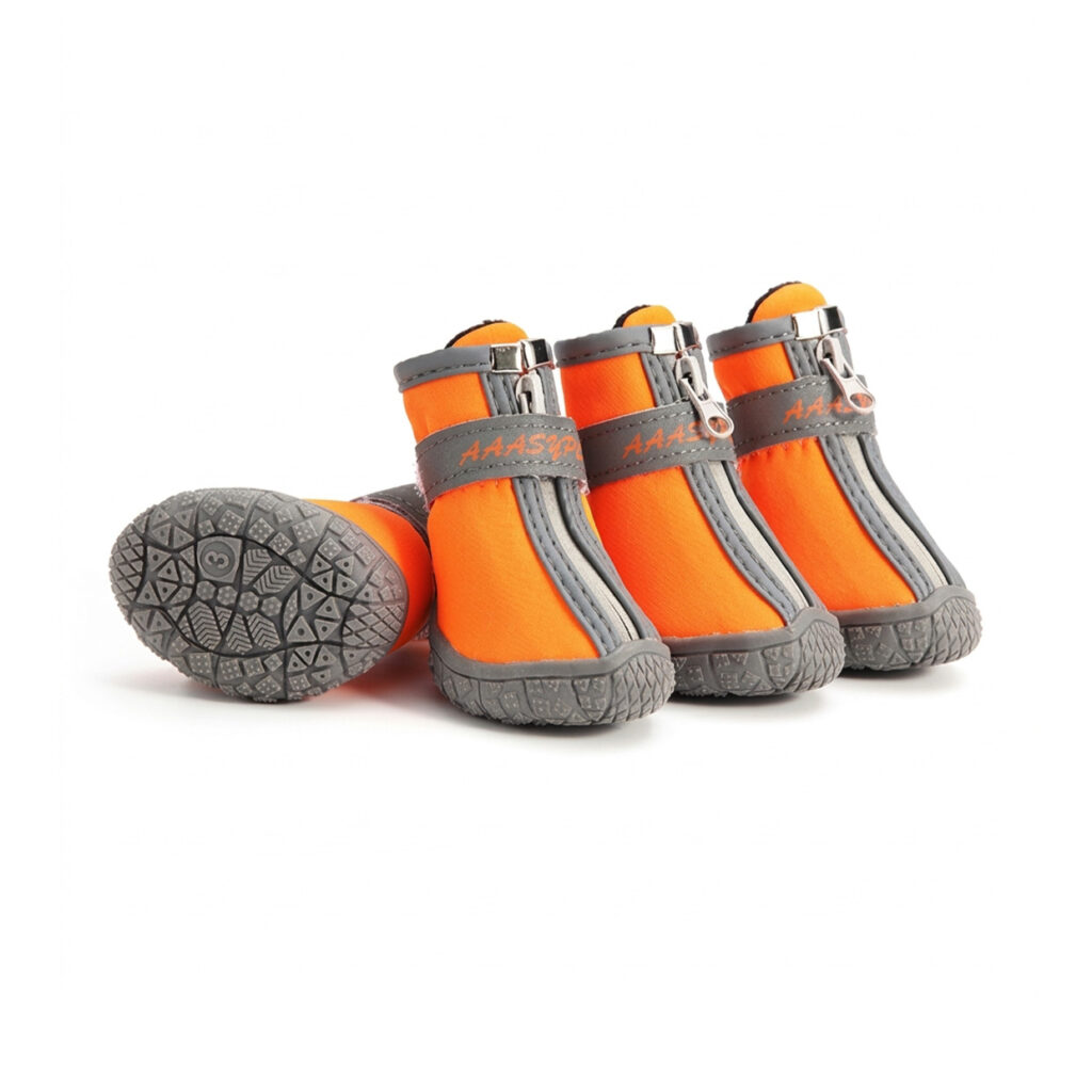 Orange all-weather waterproof zipper dog shoes in soft shell fabric showing the front zip and anti-slip chevron rubber sole.