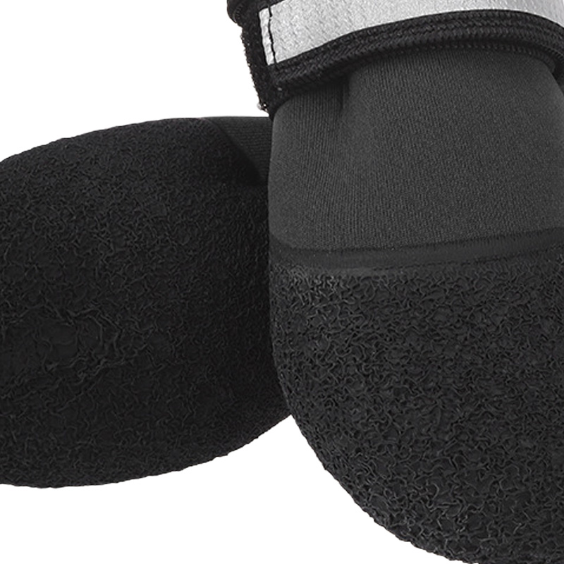 Texture macro of the raised 360 degree textured rubber bottom shell on anti-slip neoprene dog shoes.