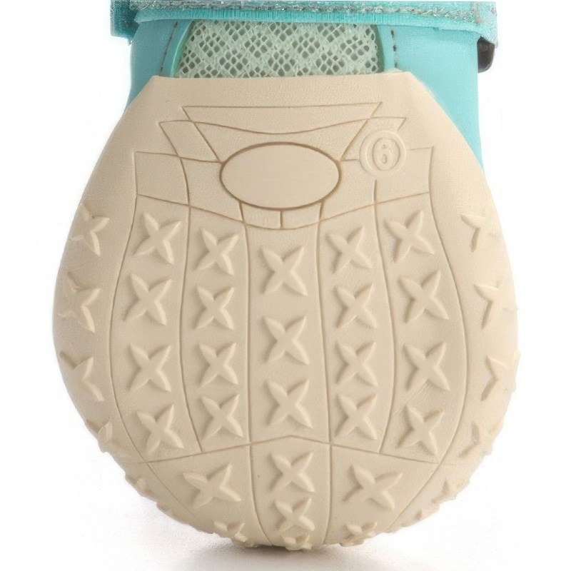 Macro texture view highlighting the molded star-shaped grip nodes on anti-slip rubber sole dog shoes.