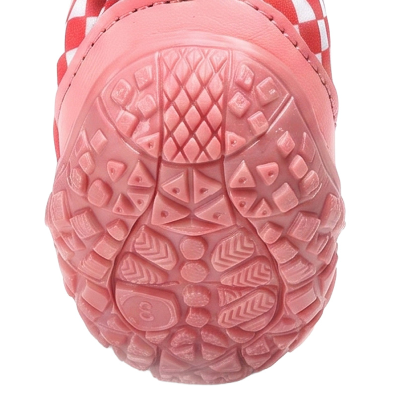 Underneath look at the textured pink rubber base profile on anti-slip rubber sole paw protectors showing geometric grooves.