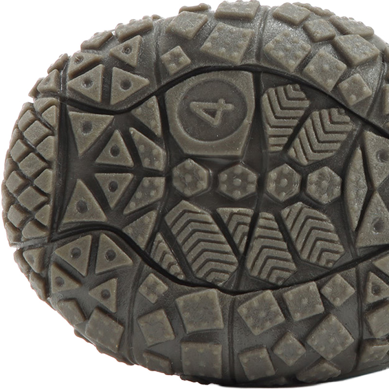 Detailed underfoot tread profile illustrating deep multi directional blocks on anti-slip rubber sole paw protectors.