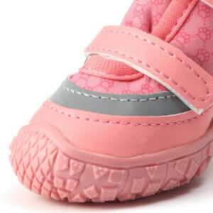 Close up look at the pink wrapped rubber toe cap bumper and wide silver reflective tracker band on waterproof dog shoes.