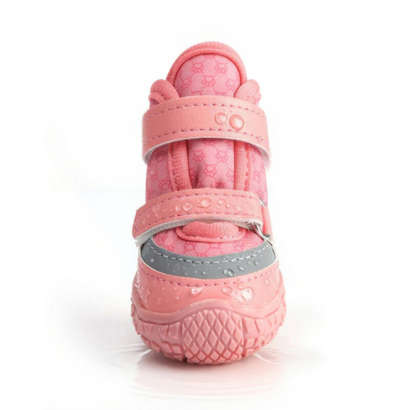Front look at a blush pink anti-slip waterproof dog shoe with water droplets beads sliding off the hydrophobic stretch shell.
