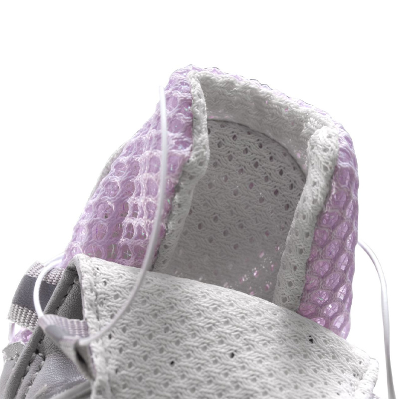 Close-up interior look at the soft triple-layer open sandwich mesh fabric lining on breathable dial-fit dog shoes.