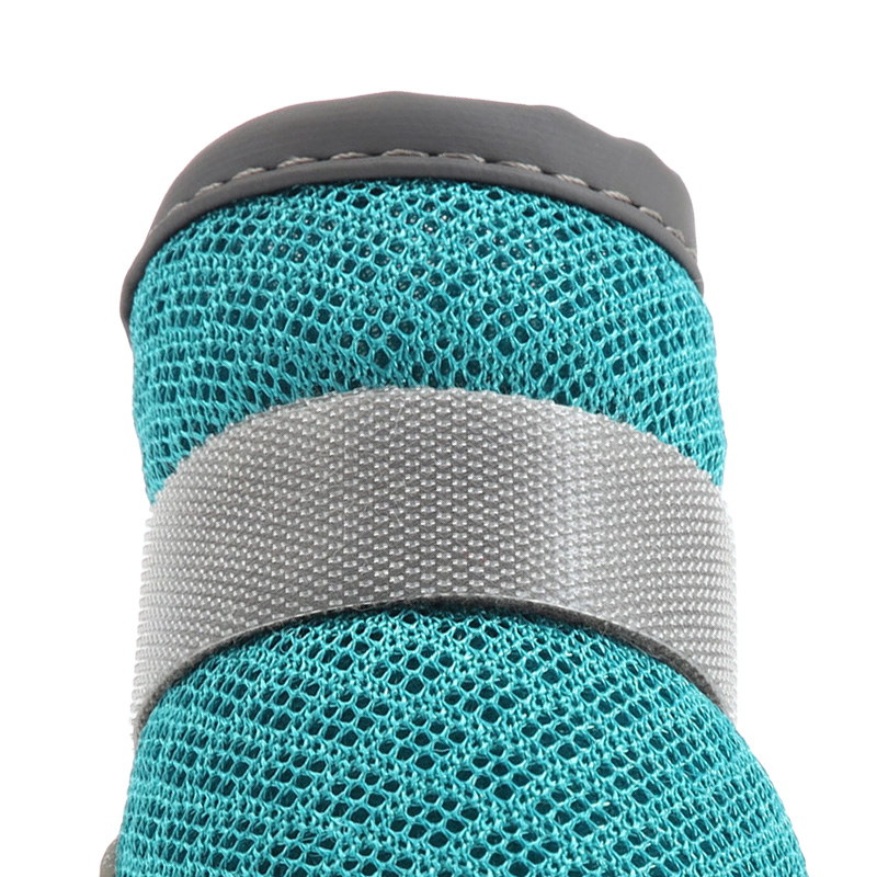 Macro view focusing on the ultra-breathable honeycomb mesh core weave configuration of lightweight protective dog shoes.