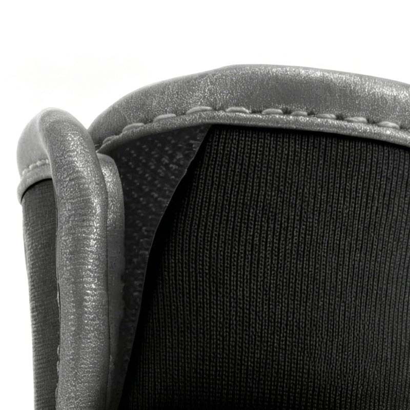 Macro view of silver reflective piping stitched on the collar of breathable sbr dog shoes.