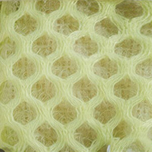 Macro view focusing on the technical multi-layered open sandwich mesh textile structure of breathable soft-sole dog shoes.