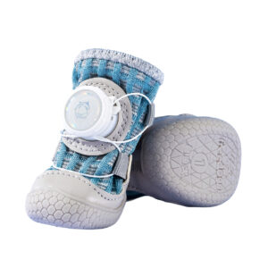 Front look next to the underfoot traction grid of denim blue breathable summer walking dog shoes with grey toe bumpers.