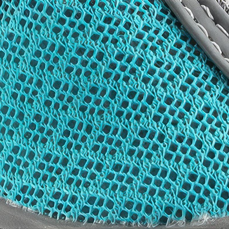 Detailed texture of the custom nine-hole technical mesh fabric used on breathable zipper dog shoes.