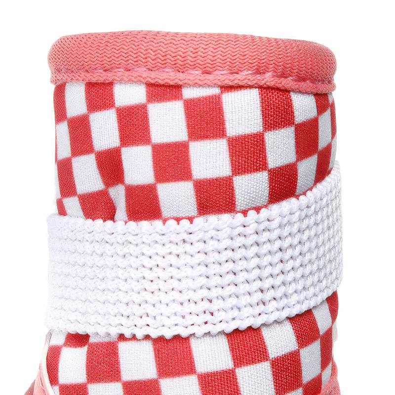Macro view focusing on the pink checkered soft canvas face and white textured ankle strap weave on dog winter boots.