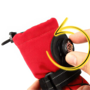 Close-up of a human hand adjusting the rotary wheel on dial lock dog shoes no slip system with directional arrows.