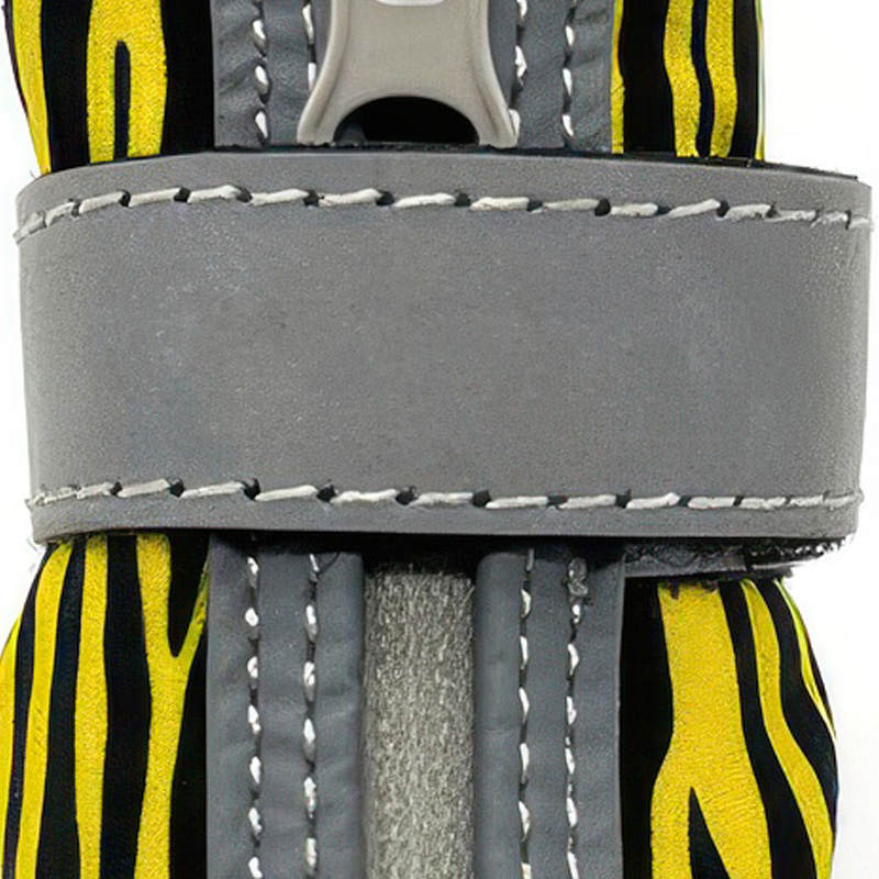 Detailed close-up of the grey high-brightness reflective wrap-around strap on easy-on-off zipper shoes for dogs.