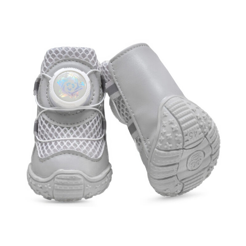 Front and underneath profile view of white flexible gum sole paw protectors showing wave patterns and a paw print logo.