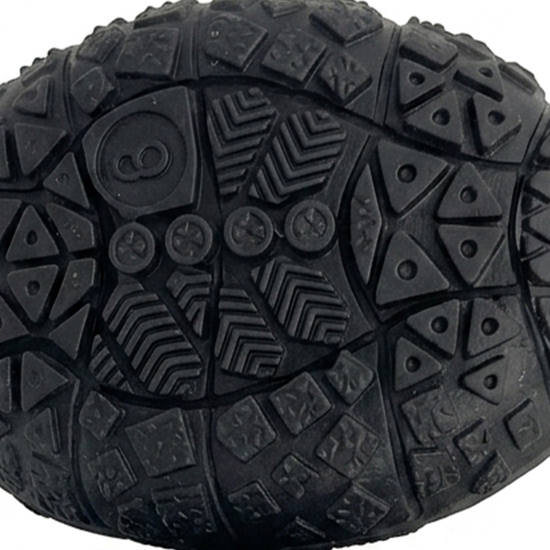 Micro texture close-up highlighting the multi-directional anti slip star patterns on flexible TPR sole pet shoes.
