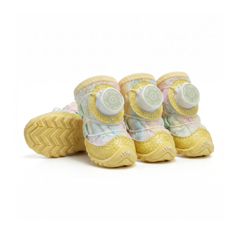 Pastel yellow gradient glow-in-the-dark dog shoes showing soft yellow paneling and white rotating dial anchors.