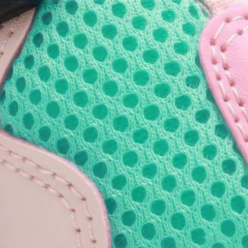 Macro view of the custom porous three-layer sandwich mesh architecture engineered for hot weather paw protectors for hiking.
