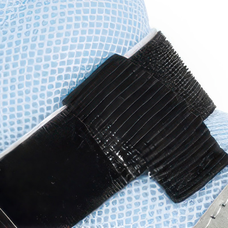 Close-up of the durable industrial black hook-and-loop strap mechanism on lightweight summer dog shoes.