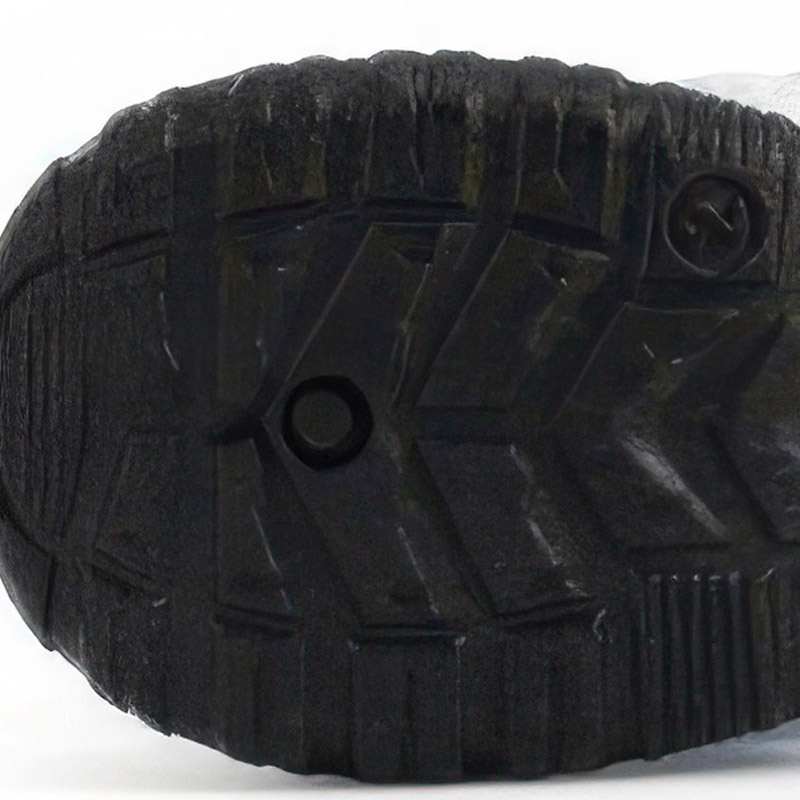 Underneath view showing the deep anti-slip chevron tread pattern on the protective black TPE outsole.