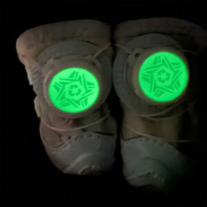 Complete dark look at night safety walking dog shoes showing two mechanical dials glowing with an intense neon green lume.