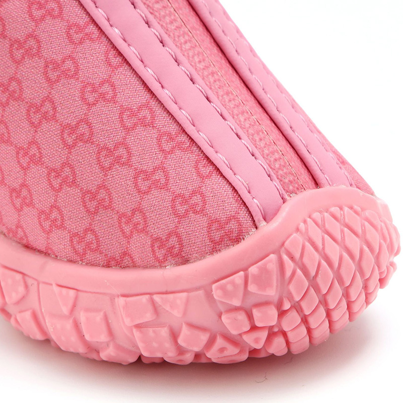 Symmetrical front view of a pink monogram dog shoe emphasizing the textured, wrapped rubber toe guard bumper.