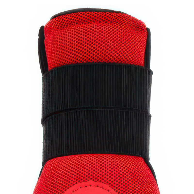 Close-up macro view of the double-strap reinforcement system layered over red mesh on protective double-strap dog shoes.
