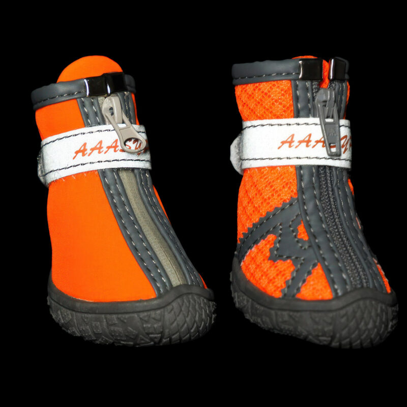 High Visibility Night Safety Reflective Strap Glow Front close-up of orange reflective easy-on-off pet shoes glowing brightly under dark low-light conditions.