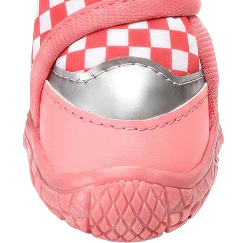 Profile detail of a red checker dog boot showing a silver reflective panel, pink leather mudguard, and stitched sole.