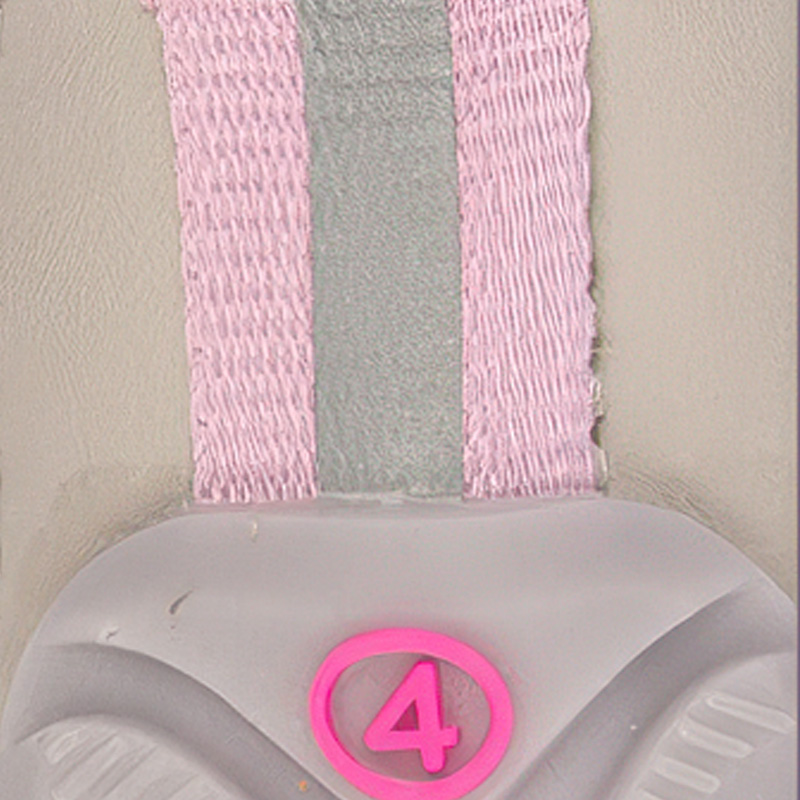 Close up look at the vertical silver retroreflective tracking band embedded along the pink pull tab of winter dog booties.