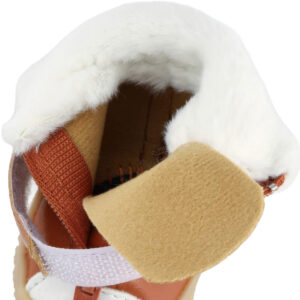 Top-down look inside a mocha brown dog shoe illustrating the soft inner fleece layer and comfortable tongue patch.