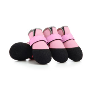 A set of pink soft-sole dog boots with flexible black rubber bottoms for indoor and outdoor protection.