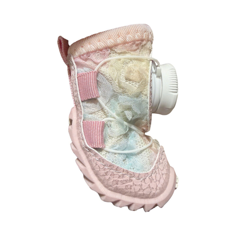 Side profile look at a unicorn pink stay-on dial-system puppy shoe showcasing the side micro-cable trace path lines.