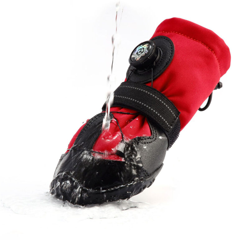 Water pouring directly onto stay-on dog shoes for active dogs demonstrating the hydrophobic impermeable fabric barrier.