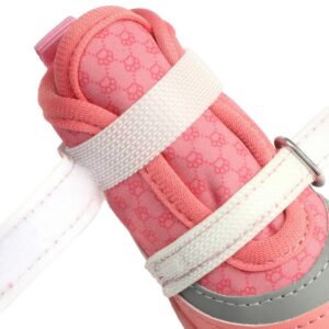 Close profile of a blush pink stay-on double velcro dog shoe with parallel hook and loop bands unfastened to show length.