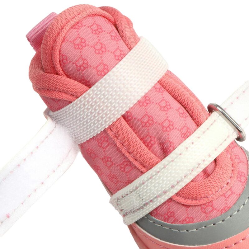 Close profile of a blush pink stay-on double velcro dog shoe with parallel hook and loop bands unfastened to show length.