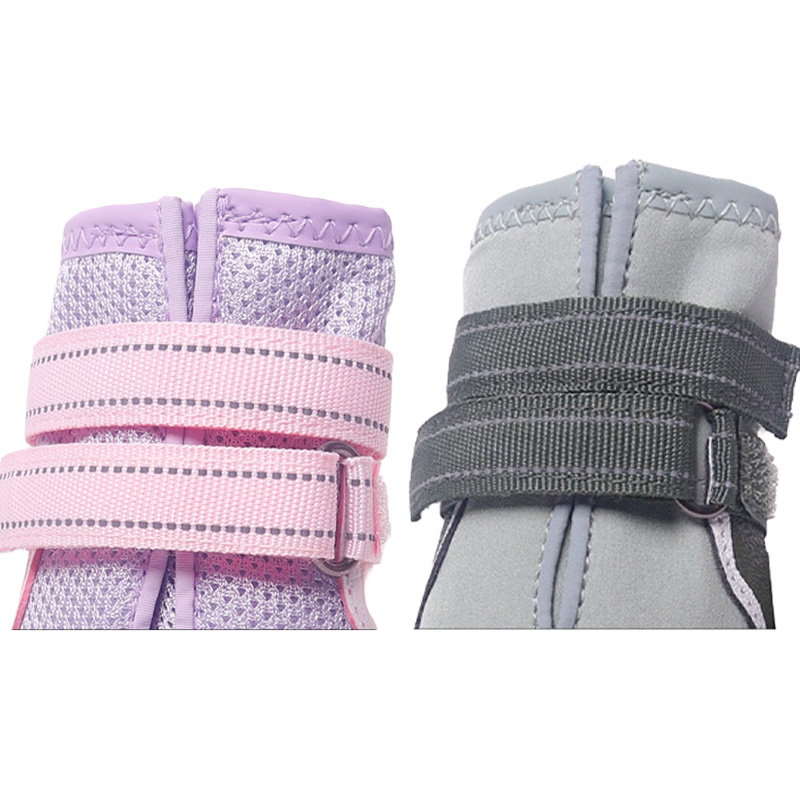 Close up look comparing pink open mesh collar trim and grey water resistant sports dog shoes double reflective straps.