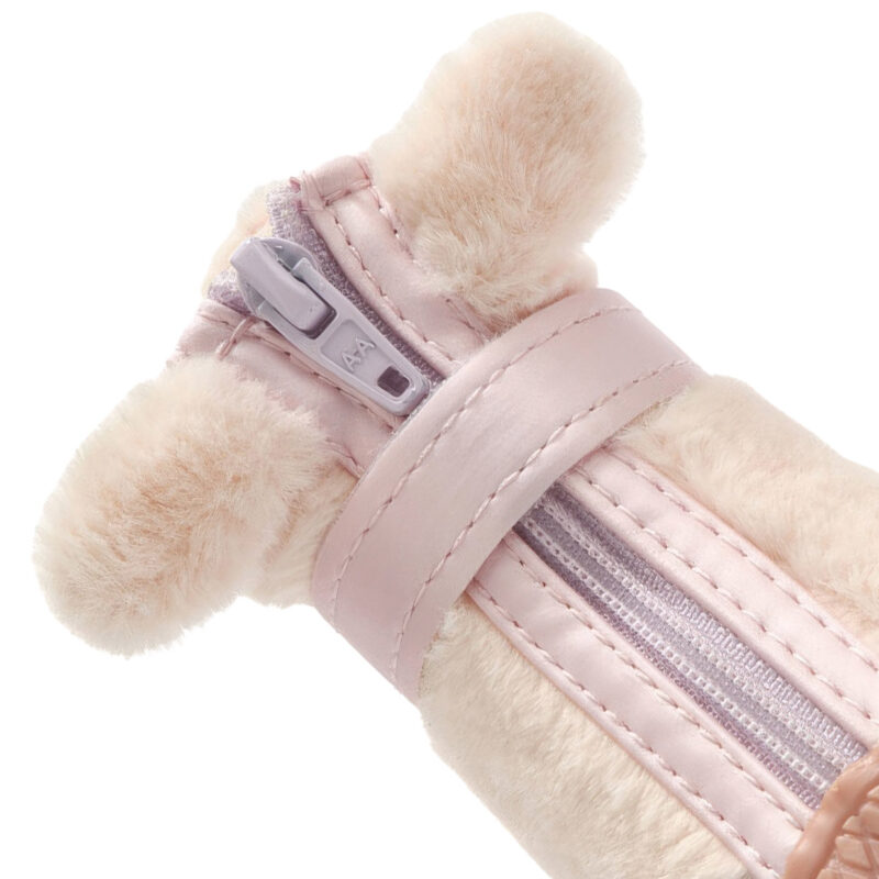 Close-up of blush pink stay-on zipper puppy shoes highlighting the smooth front zipper path and plush rabbit ears.