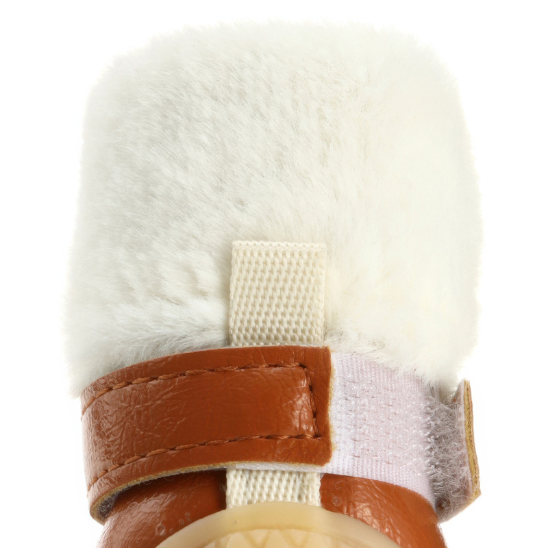 Rear upper view of water resistant leather dog shoes showing a white fur cuff and a sturdy vertical nylon webbing loop.