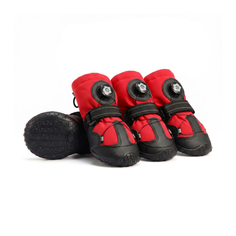 Red waterproof dial-fit dog shoes displaying the mechanical rotary adjustment wheel and black rubberized sole protective wrap.