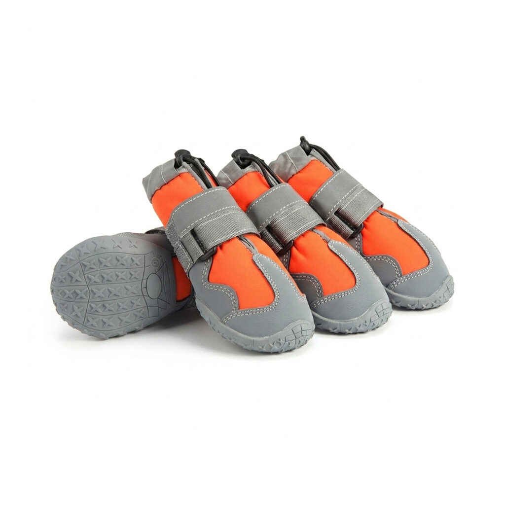 Obsidian orange waterproof high-top dog shoes displaying raised star-tread rubber outsoles and grey adjustable velcro bands.