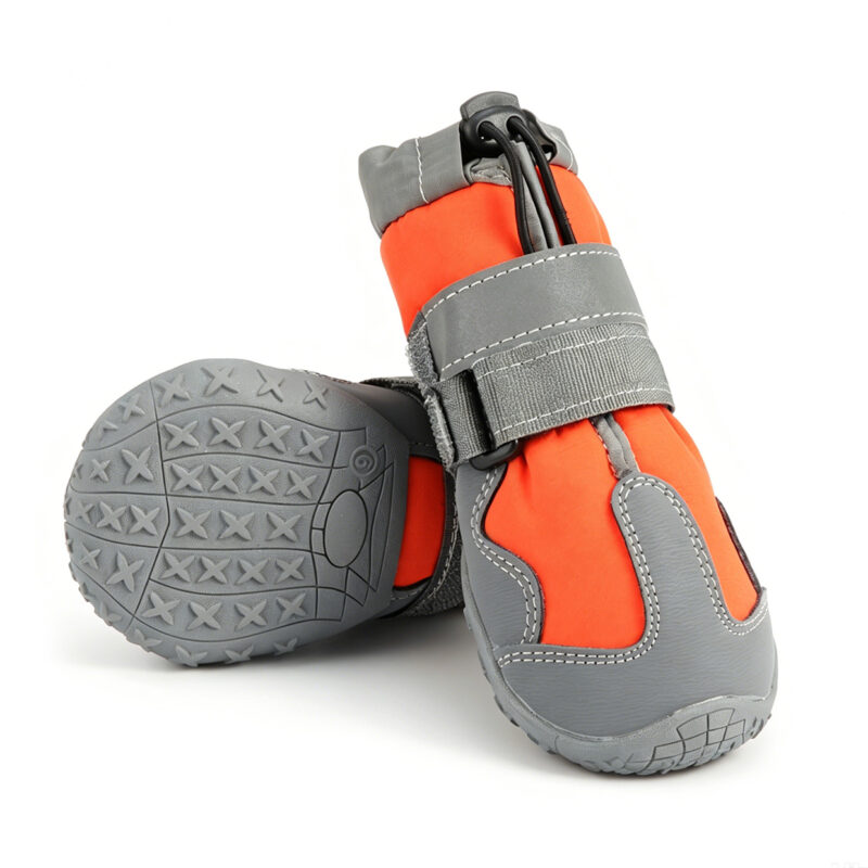 Orange Waterproof High-Top Dog Shoe Front Profile Front view of an orange waterproof high-top dog shoe highlighting gray abrasion-resistant leather toe bumpers.