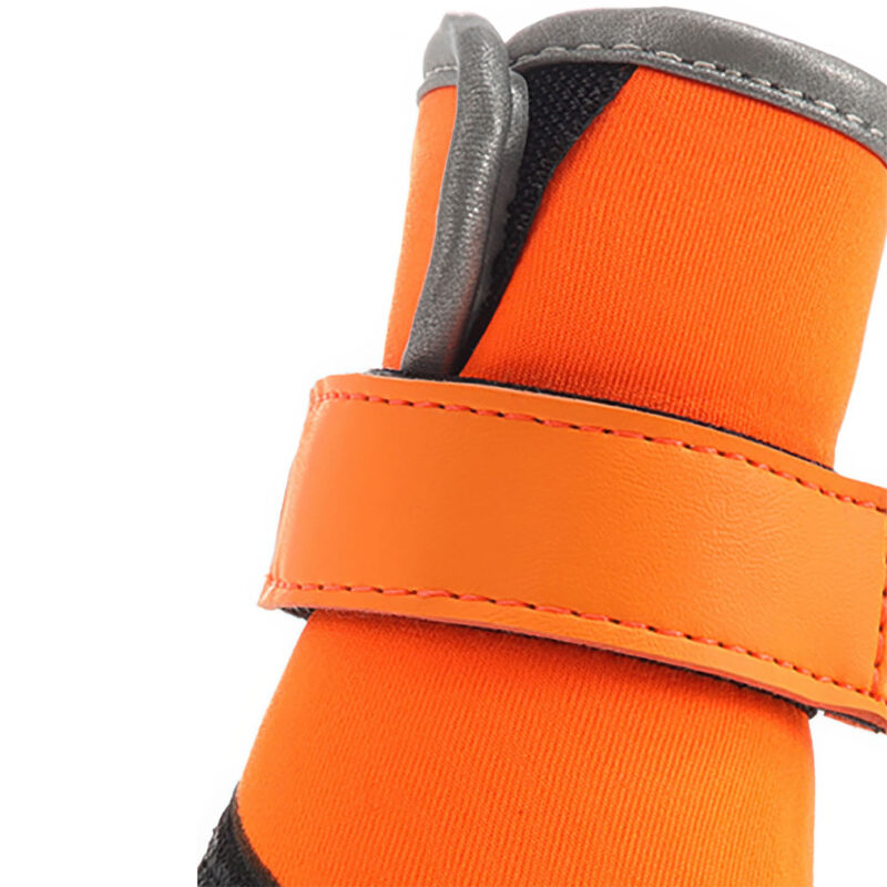 Front view of orange waterproof neoprene dog shoes showcasing the sleek unbranded aesthetic and neat stitching.