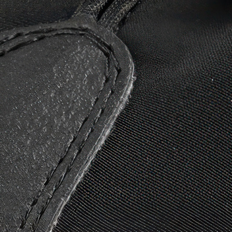 Macro close-up texture of the three-in-one four-way stretch water-repellent shell used on waterproof warm dog shoes.