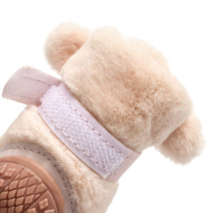 Rear macro look at a blush pink winter-warm dog shoe showcasing the high-adhesion adjustable velcro wrapping band.