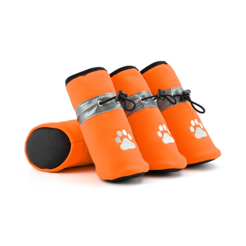 Obsidian orange winter water-resistant fleece dog shoes showcasing black rubber outsoles and reflective drawcord toggles.