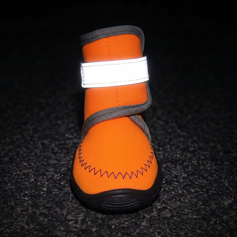 All-Weather Protective Boots High Visibility Night Safety Strap Wide silver gray panels glowing bright on all-weather protective boots under dark environment conditions for safety.
