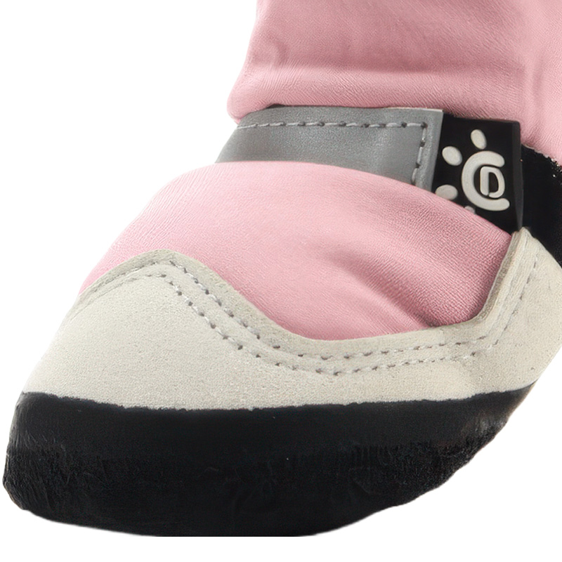 Integrated toe cap and retroreflective piping trim on blush pink all-weather protective shoes.