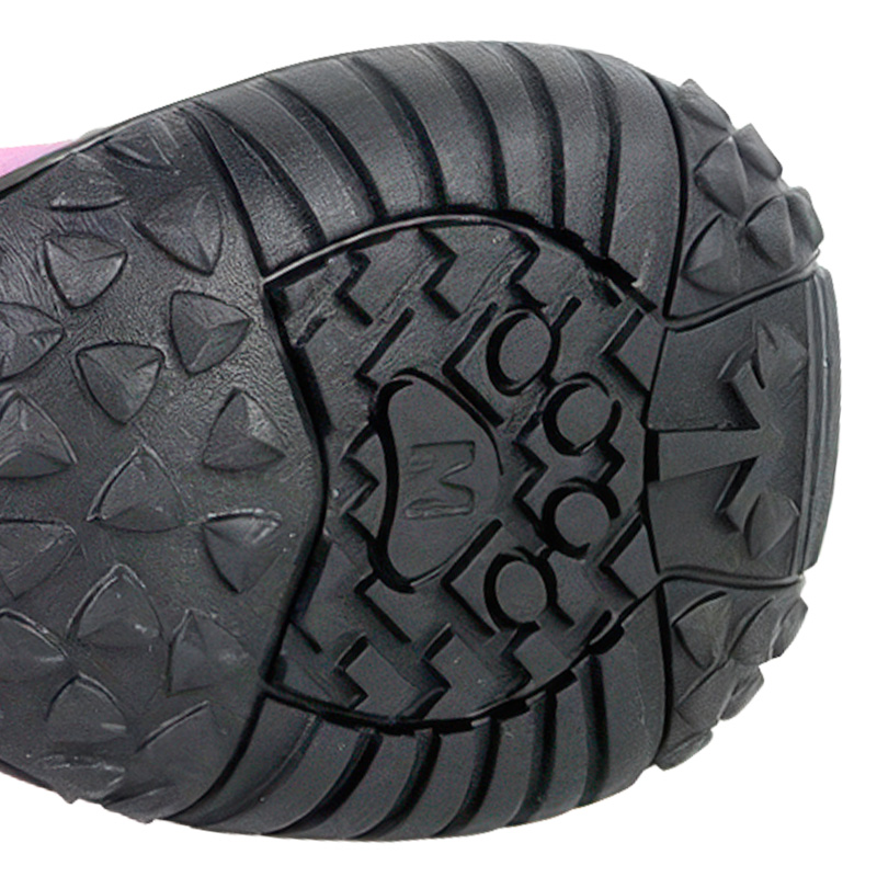 High-traction black rubber outsole on anti-slip large dog boots showcasing deep multiterrain tread patterns.