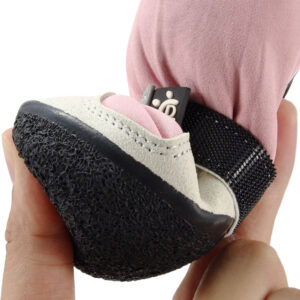 Anti-Slip Latex Sole Boots Flexibility Demonstration Anti-slip latex sole boots demonstrating flexible organic bend and high-elasticity cushioning under finger pressure.