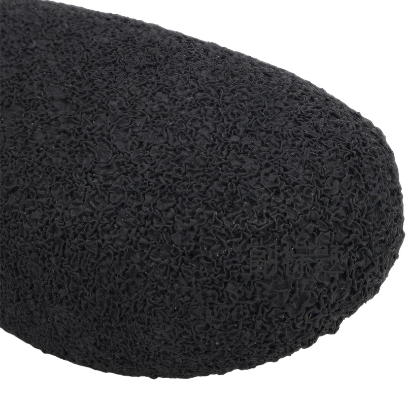 High-traction texturized rubber base on anti-slip latex sole boots demonstrating heavy-duty grip.