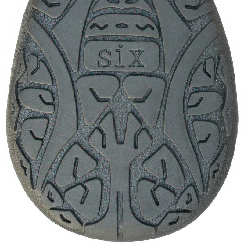 High-traction bottom matrix on anti-slip rubber dog boots displaying deep geometric stability channels.